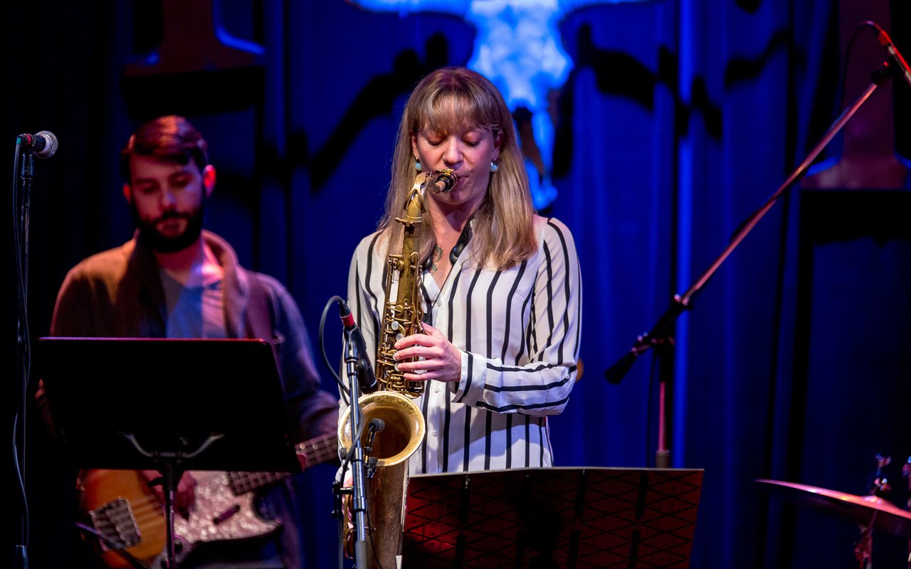 Kate Olson playing saxophone, photo by Daniel Sheehan.