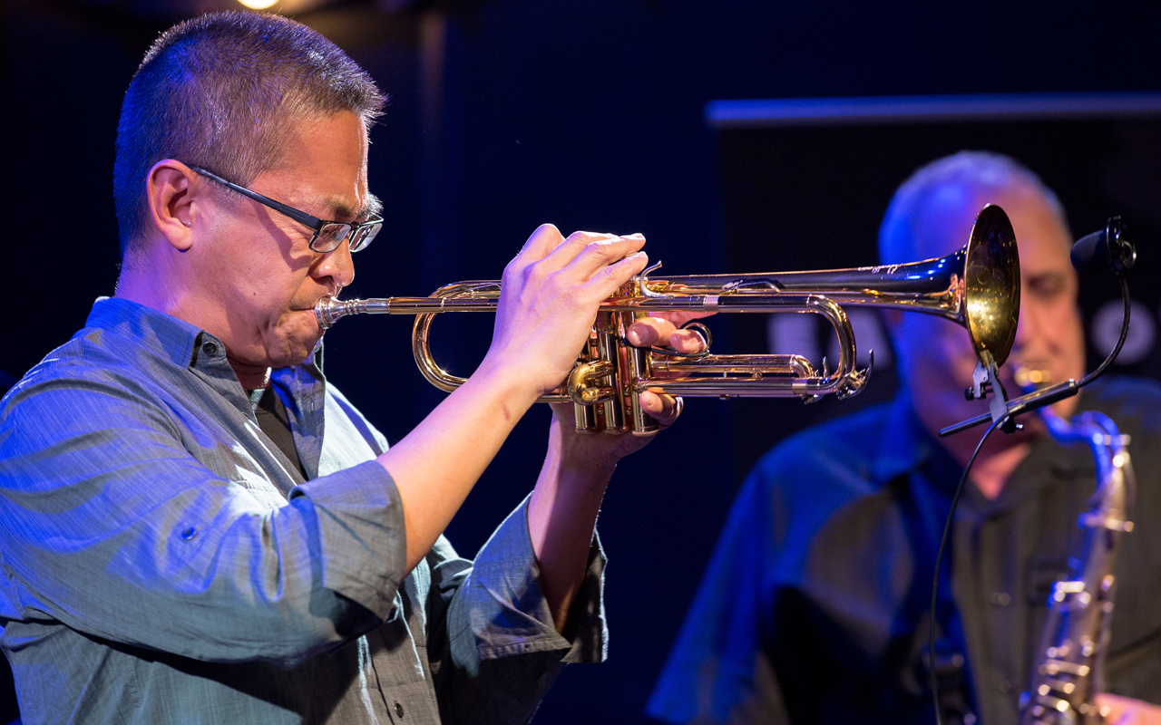 Cuong Vu playing trumpet, photo by Daniel Sheehan.