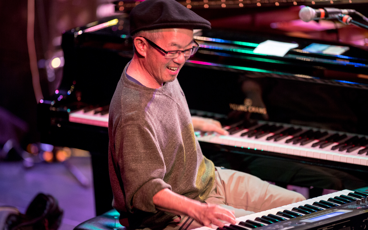 Deems Tsutakawa playing piano and keyboard, photo by Daniel Sheehan.