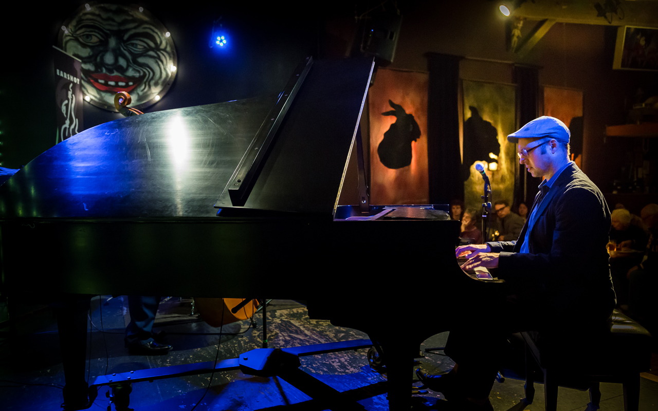 George Colligan playing piano, photo by Daniel Sheehan.