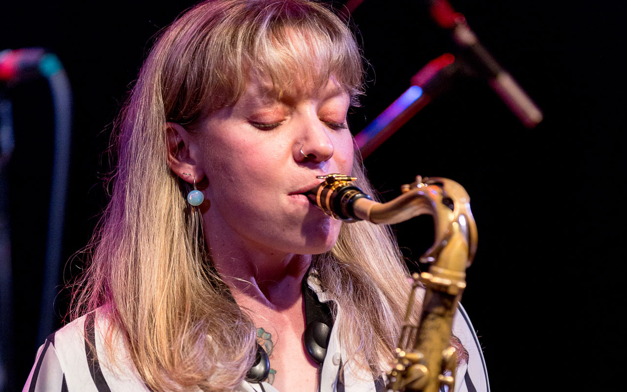 Kate Olson by Daniel Sheehan Kate Olson playing a saxophone