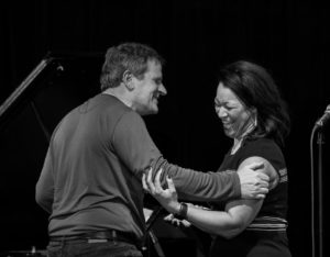 Randy Halberstadt being congratulated by Jacqueline Tabor.