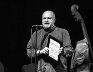 Michael Brockman accepting the award on behalf of the Seattle Repertory Jazz Orchestra.