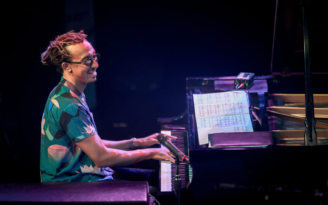 Gerald Clayton playing piano on the Triple Door stage