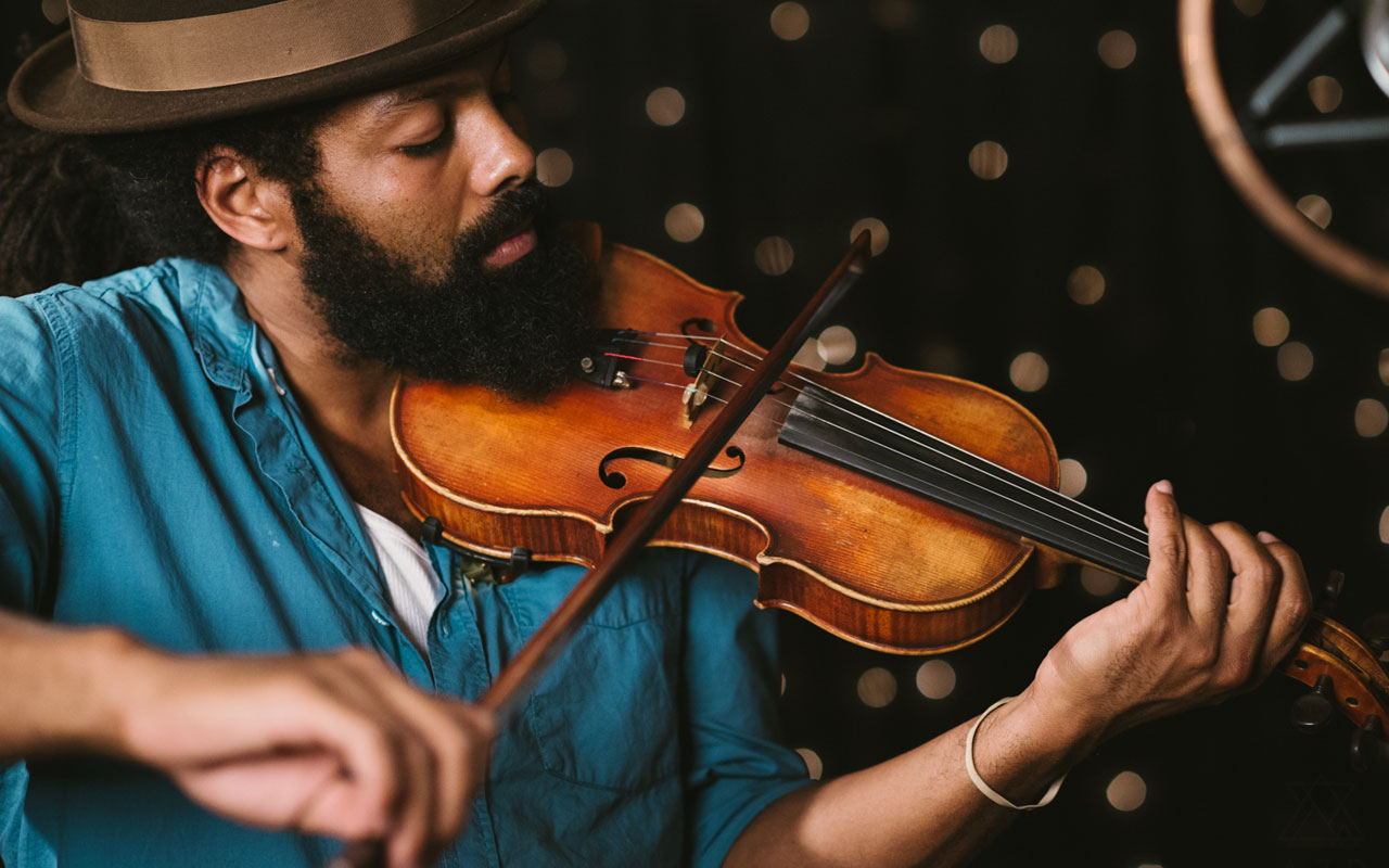 Benjamin Hunter playing a violin