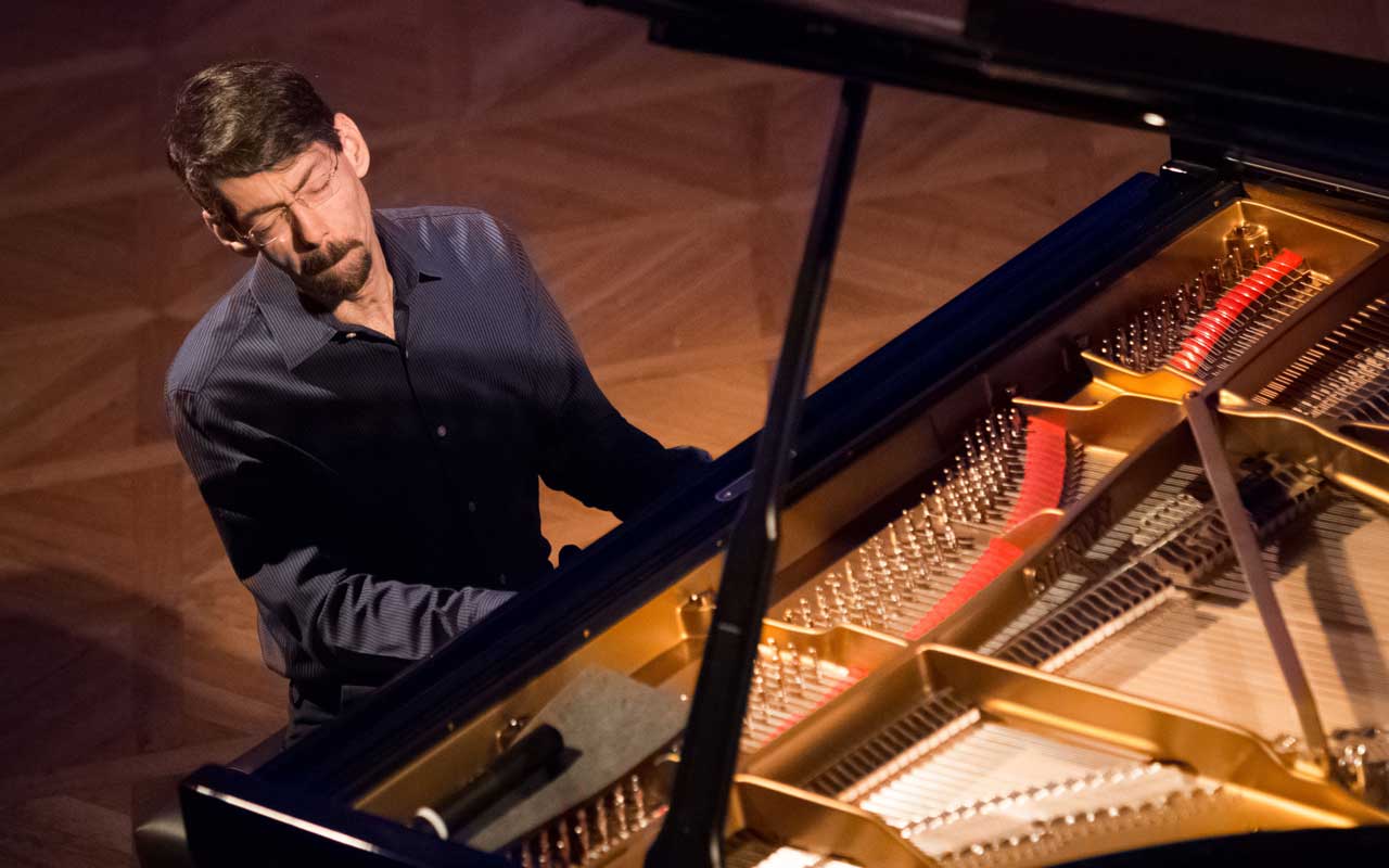 Fred Hersch playing a piano