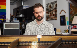 Alex Chadsey playing the piano.